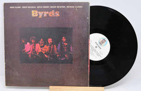 A vinyl record of The Byrds titled 'Byrds' with the band members pictured on the cover.