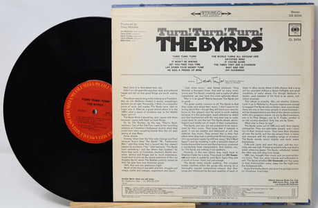 The Byrds 'Turn Turn Turn' vinyl record LP with the black record partially visible behind the printed back cover, photographed on a white background.