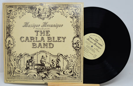 Front cover of The Carla Bley Band - Musique Mecanique vinyl LP with ornate artwork