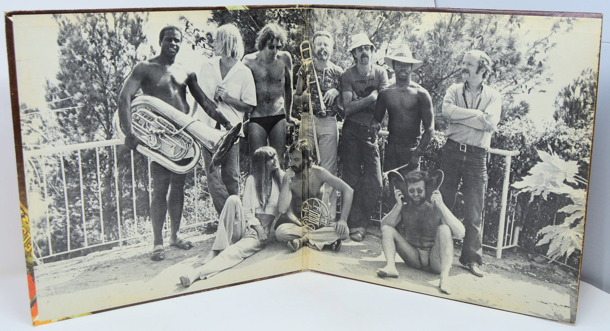 Vintage black and white group photo of The Carla Bley Band with instruments during 1977 European tour