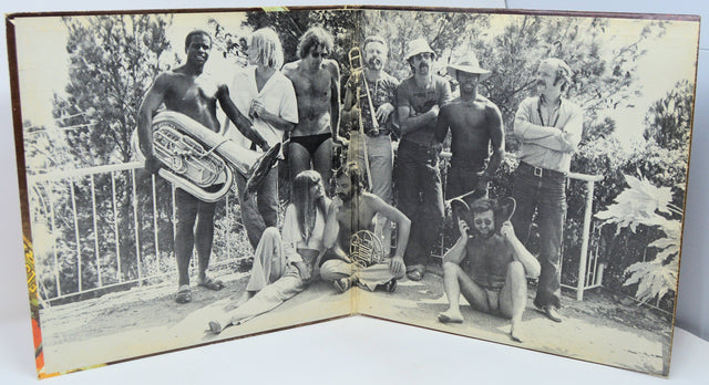 Vintage black and white group photo of The Carla Bley Band with instruments during 1977 European tour