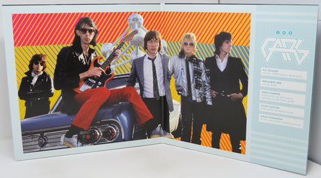 Music album cover with band members and colorful background