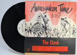 A vinyl record partially pulled from its sleeve for the Clash's 'Armagideon Time' album, photographed against a plain light background.