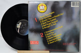 Vinyl record with cover featuring tracklist on a white background