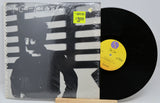 Front cover of The Cure Let's Go To Bed vinyl with price sticker and unique striped light shadow