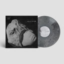 A vinyl record of The Cure's album 'Songs Of A Lost World' with a sculpture-like object on the cover, predominantly in gray and black tones.