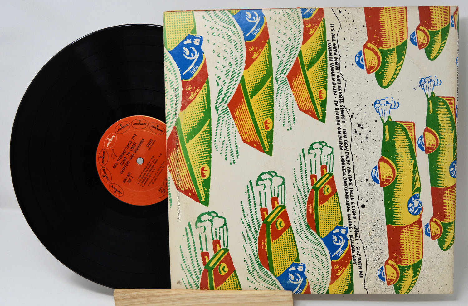 Vinyl record with a colorful, patterned cover on a white background