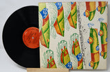 Vinyl record with a colorful, patterned cover on a white background