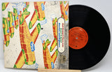 Vinyl record with a colorful cover featuring abstract designs.
