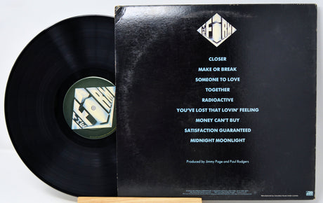 Vinyl record with cover displaying tracklist on a white background