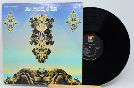 The Fraternity of Man vinyl record with back album cover showcasing surreal rock artwork