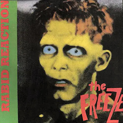 Album cover with a stylized portrait of a person with a greenish complexion and blue eyes, featuring the text 'Rabid Reaction' and 'the FREEZE'.