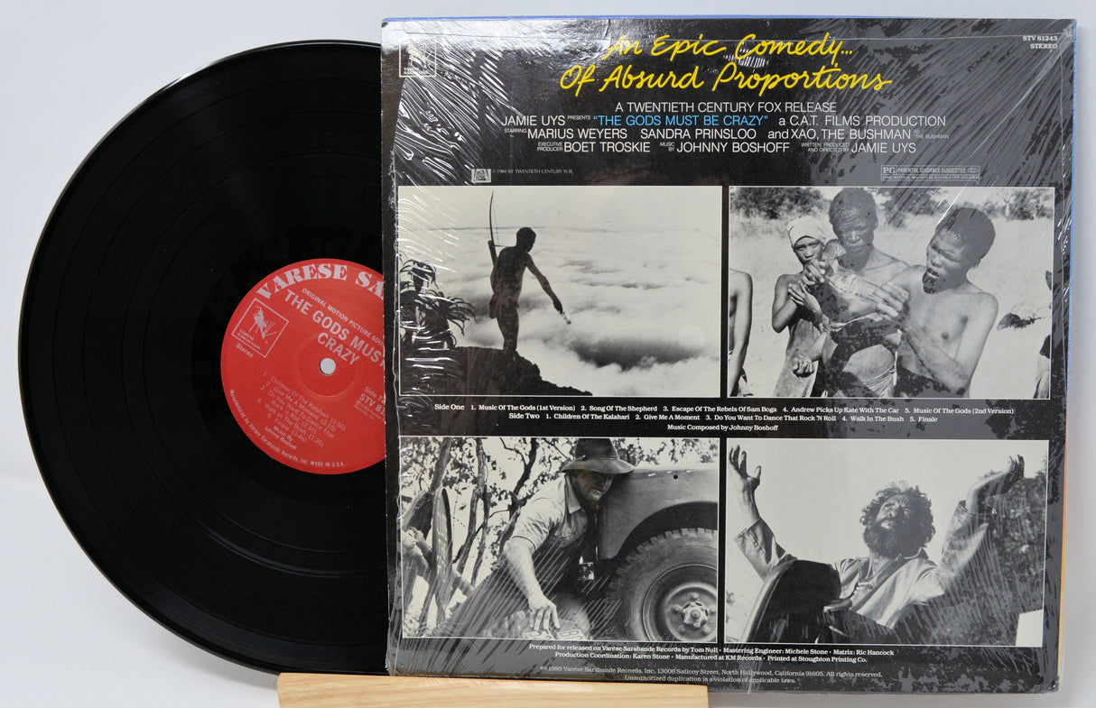 Back cover and vinyl record of The Gods Must Be Crazy original soundtrack with vintage black and white film stills