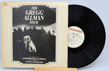 Vinyl record with cover featuring 'The Gregg Allman Tour' on a light blue background