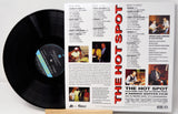 Back cover of The Hot Spot soundtrack vinyl with track list, musician credits, and photos.