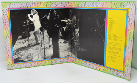 Album cover with black and white photos and a yellow text section on a colorful border.