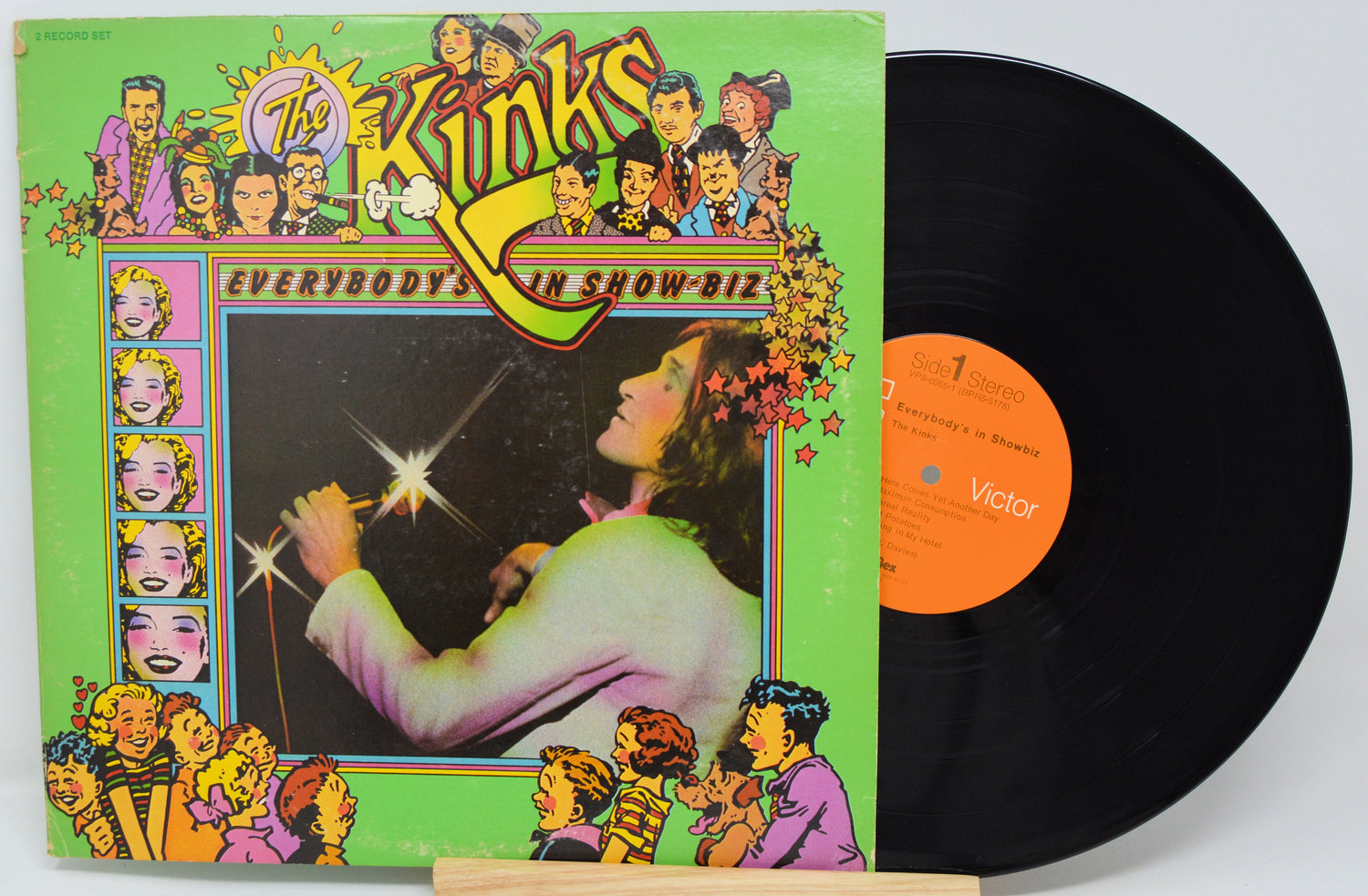 Vinyl record with colorful cover featuring illustrations and text