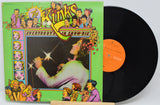 Vinyl record with colorful cover featuring illustrations and text