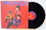 Vinyl record with 'The Knack' album cover showing four band members on a red background.