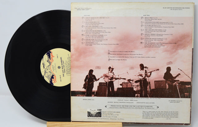 Back cover and vinyl record of The Last Mile Ramblers – While They Last! album, showing tracklist and band photo