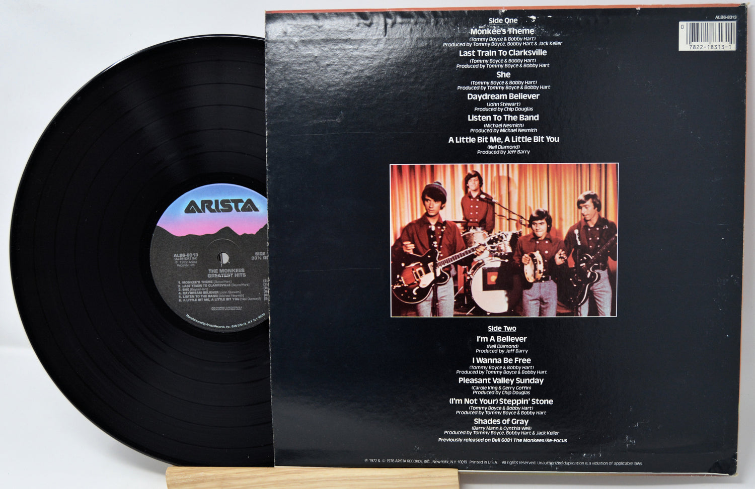 Vinyl record with cover featuring a band on stage and Arista logo.