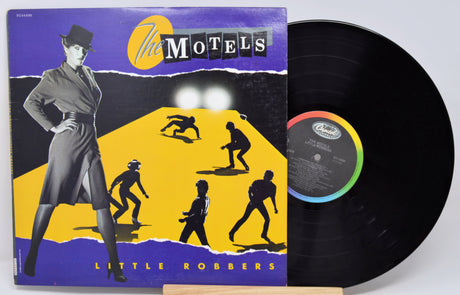 Vinyl record with cover featuring a stylized illustration of a woman and figures, titled 'Little Robbers' by The Motels.