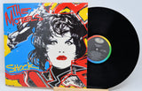 Vinyl record with colorful cover featuring a stylized portrait and text.