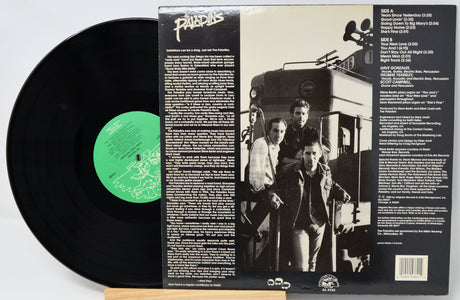 Vinyl record with green label and its cover showing a black and white photo of two men and text.