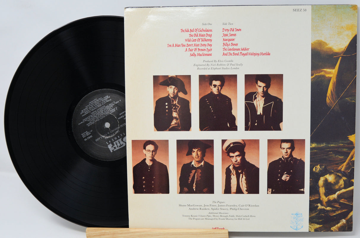 Vinyl record with a cover featuring portraits of a person and a scenic image.