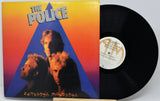 Vinyl record with 'The Police' album cover featuring band members and a colorful design.