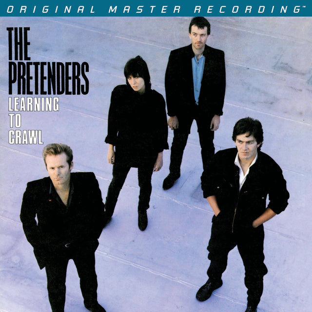 Album cover of 'Learning to Crawl' by The Pretenders featuring four band members.