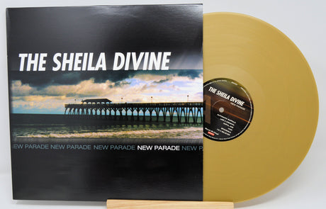 Front cover and gold vinyl of The Sheila Divine's New Parade album with pier photograph