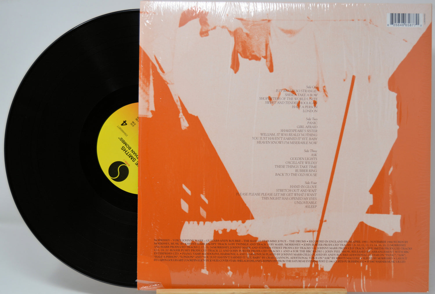 Vinyl record with a black disc and orange and white cover