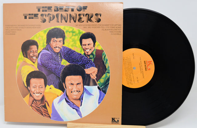 Vinyl record and cover titled 'The Best of The Spinners' on a white background