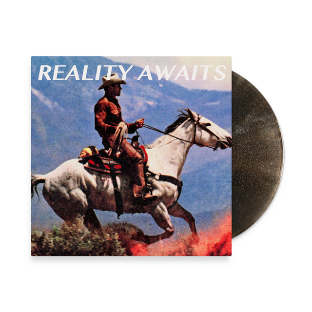 Vinyl record by The Strokes with a cover featuring a cowboy on a horse and 'Reality Awaits' text.