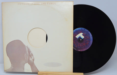 Vinyl record with cover showing a silhouette of a person and a stylized eye design.