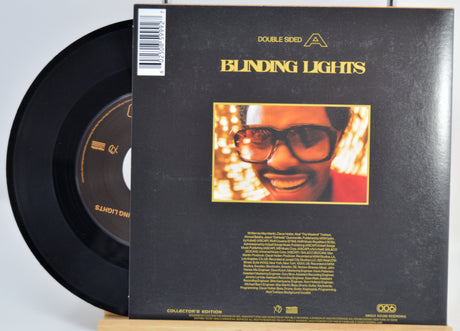 The Weeknd Vinyl record with 'Blinding Lights' album cover featuring a person with glasses and lights. Back Cover and Vinyl