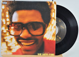 Vinyl record cover featuring The Weeknd wearing sunglasses against a blurred light background for the song Heartless