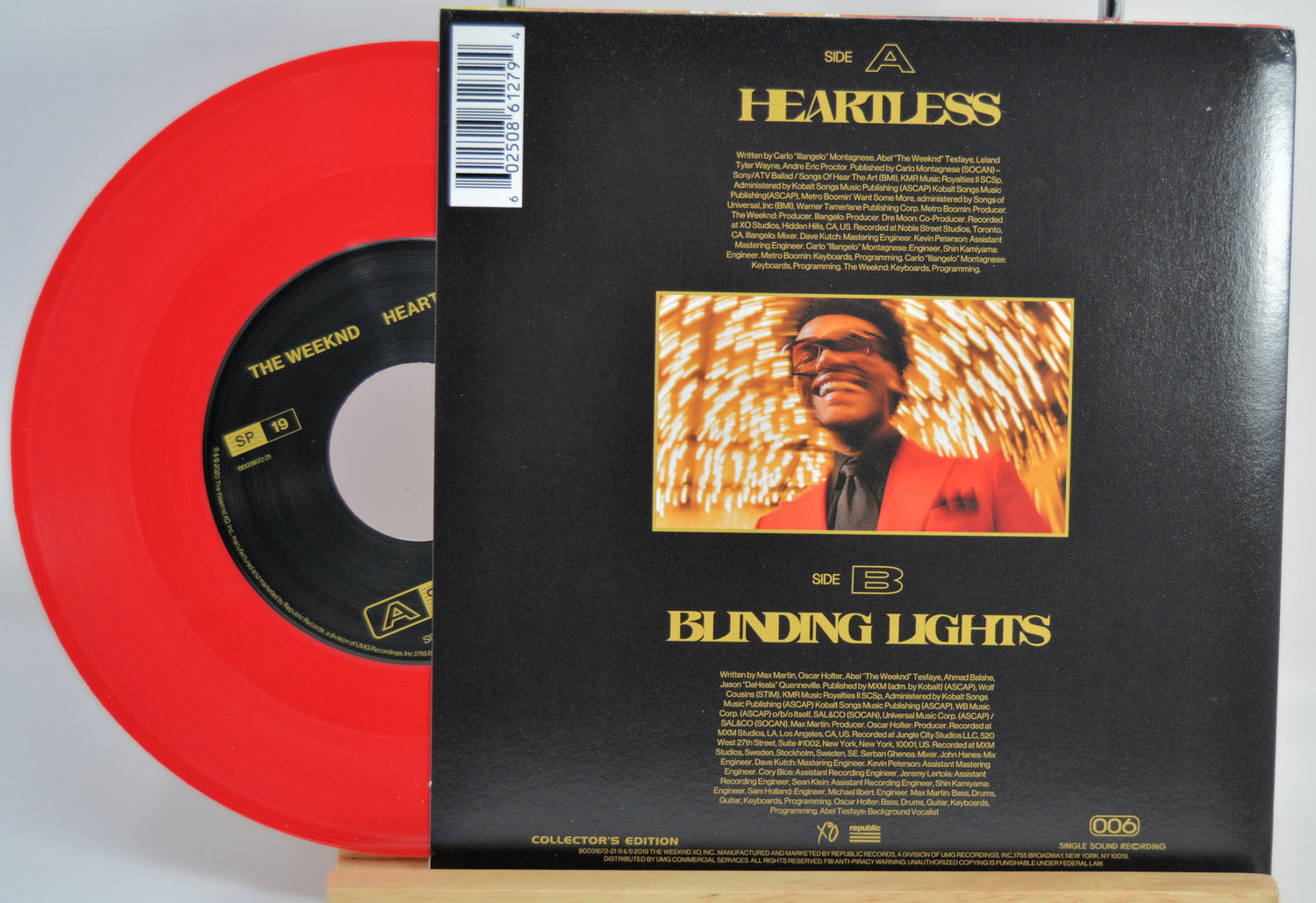 The Weeknd Red vinyl record with 'Heartless' and 'Blinding Lights' back cover on a white background