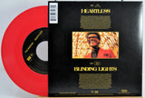 Th Weeknd red Vinyl record with disc and black back cover featuring album art and text for Heartless and Blinding Lights.
