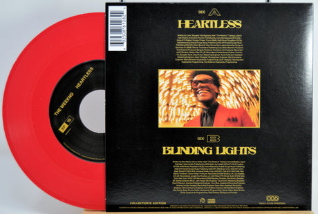 Th Weeknd red Vinyl record with disc and black back cover featuring album art and text for Heartless and Blinding Lights.