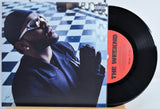 7 Inch Vinyl record front cover featuring 'The Weeknd' on a checkered floor background.