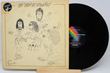 Vinyl record with cover featuring illustrations and 'The Who by Numbers' text