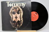 Vinyl record and cover titled 'Tommy' by The Who on a white background