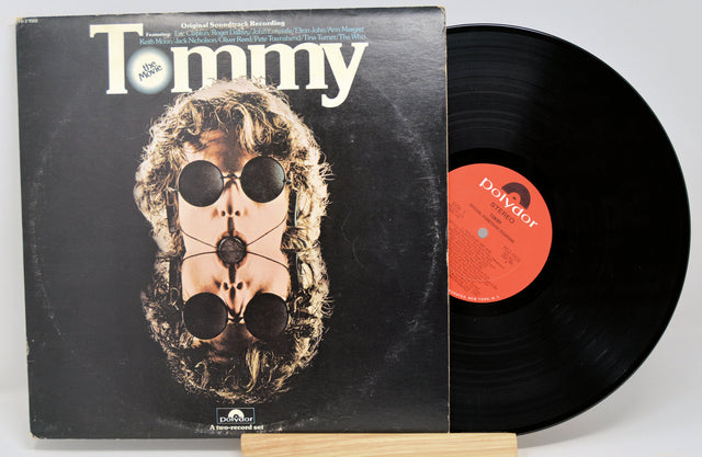 Vinyl record and cover titled 'Tommy' by The Who on a white background