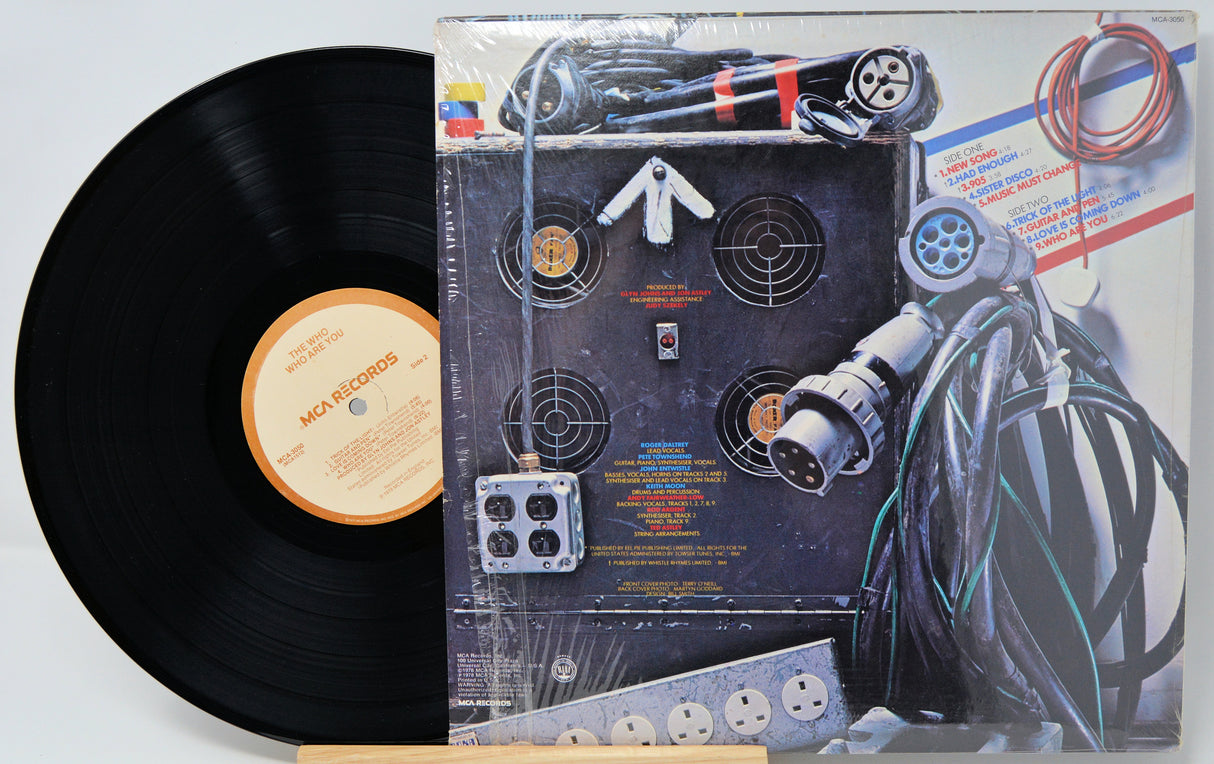 Vinyl record with a detailed cover featuring mechanical designs.