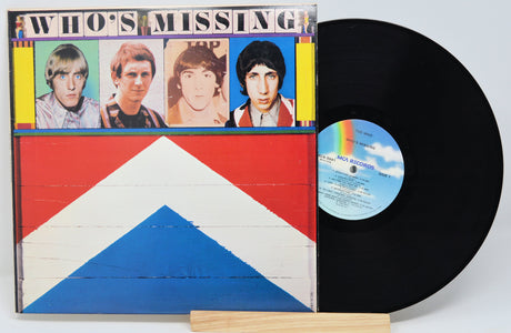 A vinyl record titled 'Who's Missing' by The Who, displayed in its sleeve with the band's name and a graphic design. The record itself is black, and there is a label with a barcode and text on the upper part of the sleeve.