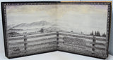 Open book with printed landscape and text on a white background