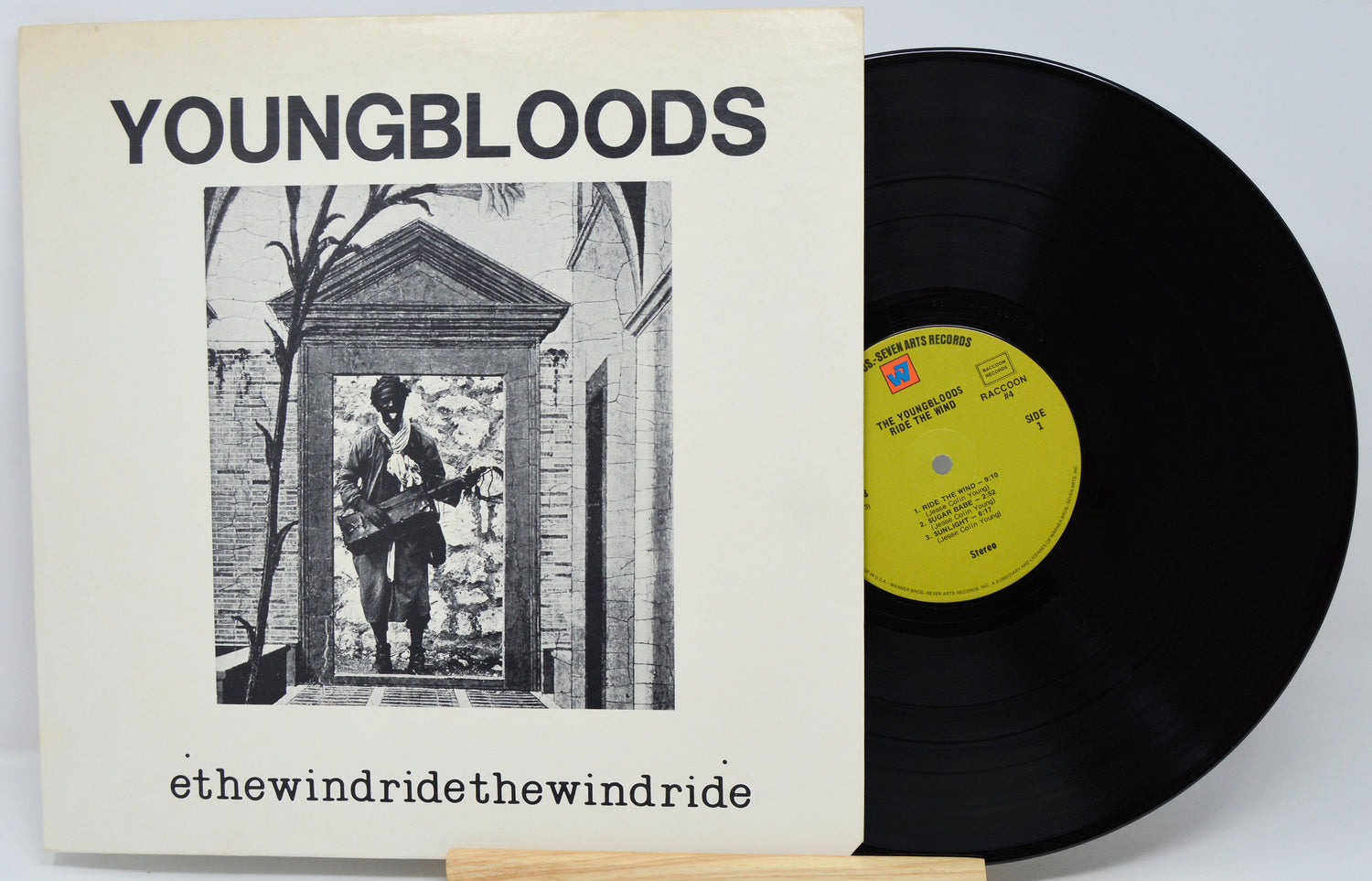 Vinyl record and cover with 'Youngbloods' album art on a white background