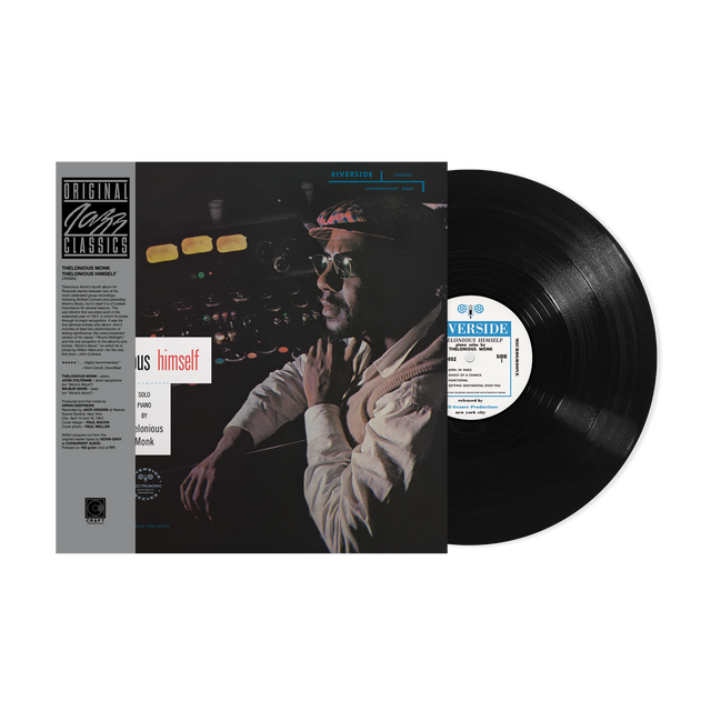 Vinyl record with cover featuring a person and text on a black background